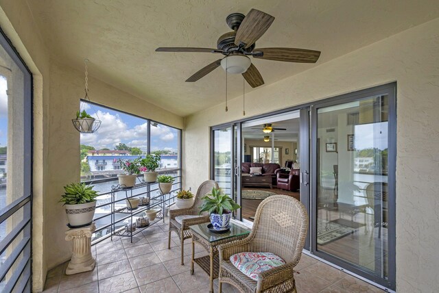 sunroom / solarium with ceiling fan