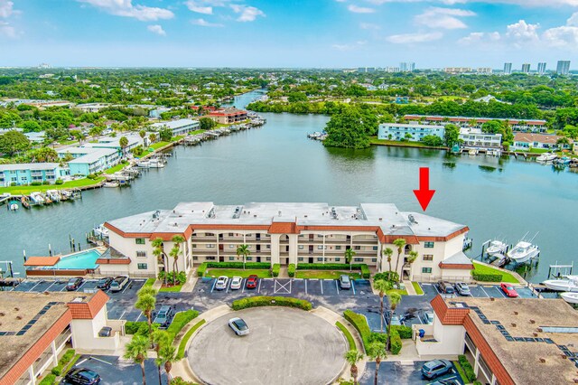 birds eye view of property with a water view