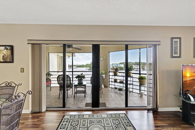 doorway featuring wood-type flooring and a textured ceiling