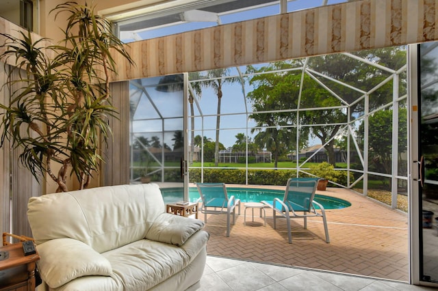 view of swimming pool with an outdoor living space, a patio, and glass enclosure