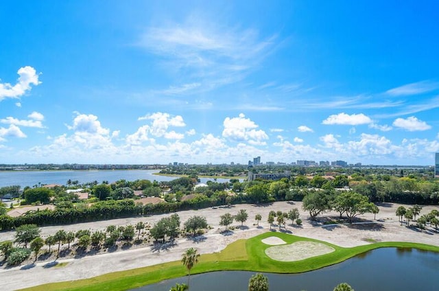 birds eye view of property featuring view of golf course, a water view, and a city view