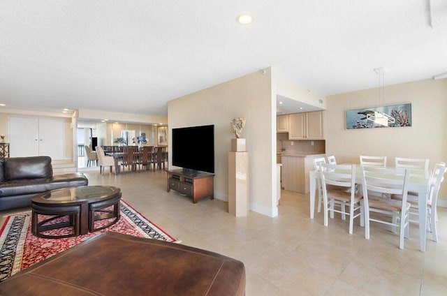 living room with recessed lighting and baseboards