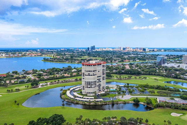 aerial view with a view of city, view of golf course, and a water view