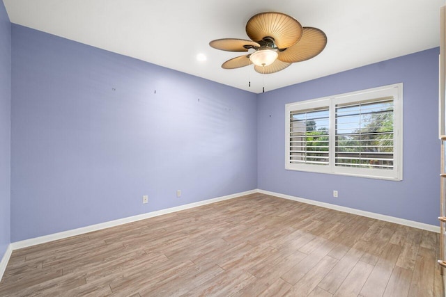 empty room with light wood-style flooring, baseboards, and ceiling fan