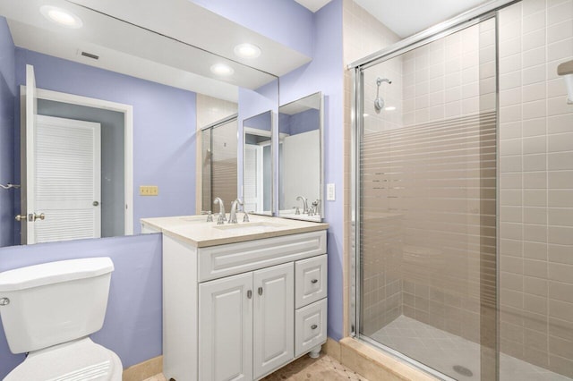 full bathroom featuring recessed lighting, visible vents, toilet, a stall shower, and vanity