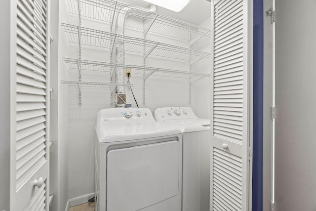 clothes washing area with laundry area and washing machine and dryer