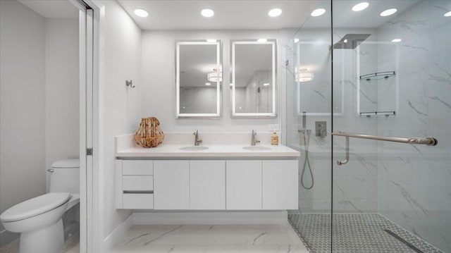 bathroom featuring an enclosed shower, vanity, and toilet