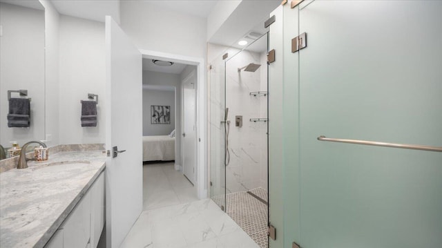 bathroom featuring walk in shower and vanity