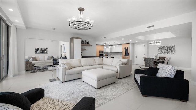 living room featuring a notable chandelier