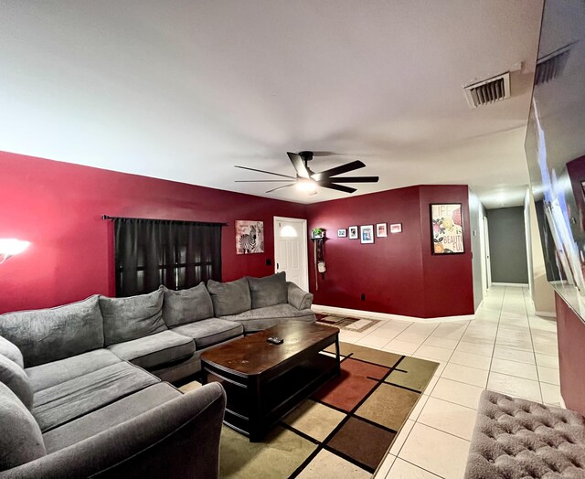 tiled living room with ceiling fan