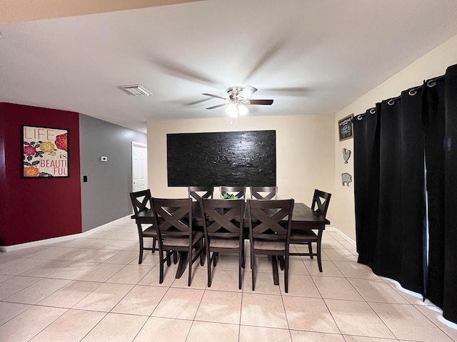 tiled dining room with ceiling fan