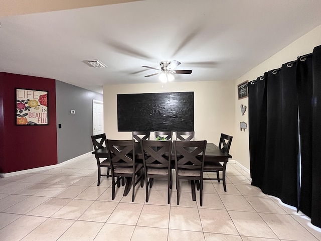 dining area with ceiling fan and light tile patterned floors