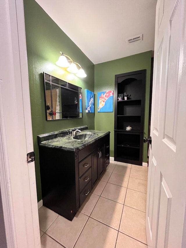 bathroom featuring tile patterned floors and vanity