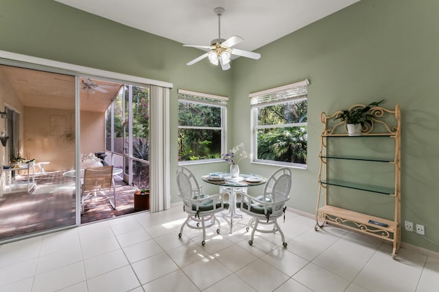 dining space featuring light tile patterned floors and ceiling fan