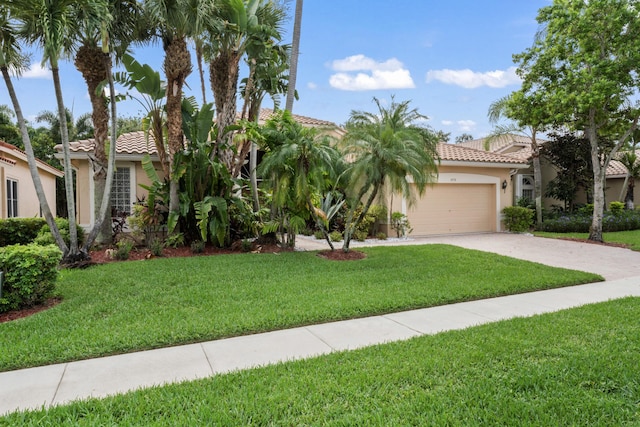 mediterranean / spanish house with a garage and a front lawn