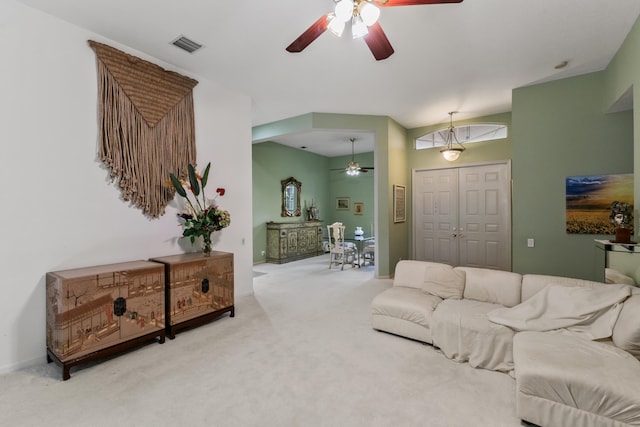 living room featuring ceiling fan and carpet floors