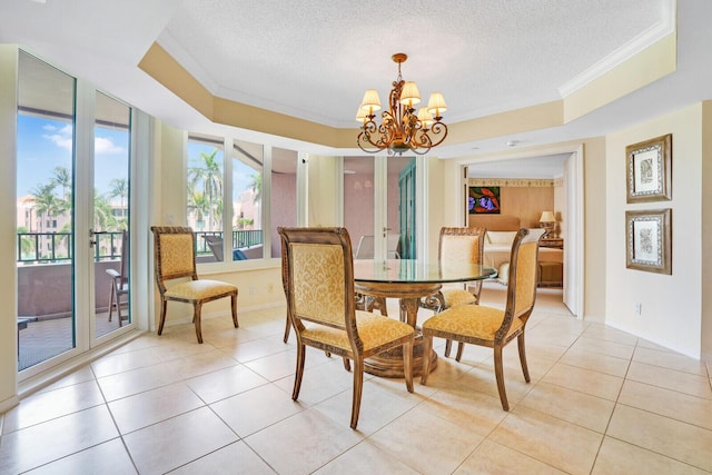 dining area featuring a chandelier, crown molding, light tile patterned floors, and a textured ceiling