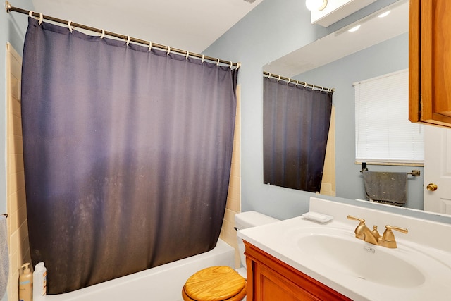 full bathroom featuring vanity, toilet, and shower / bath combination with curtain