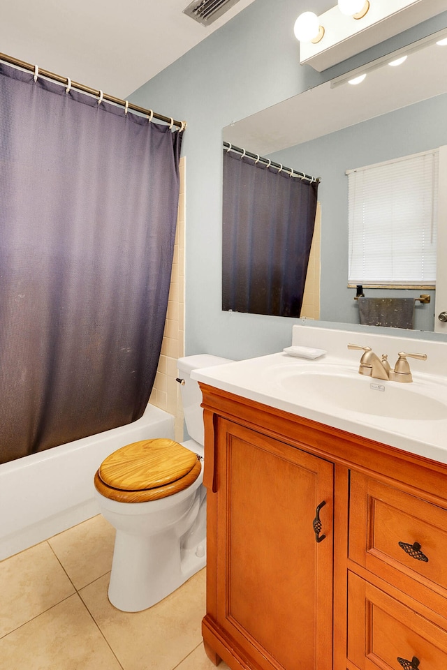 full bathroom with tile patterned floors, vanity, toilet, and shower / bath combination with curtain