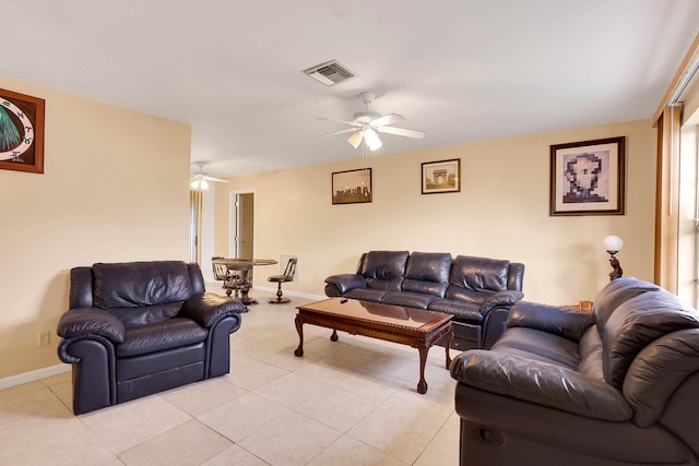 living room with light tile patterned floors and ceiling fan