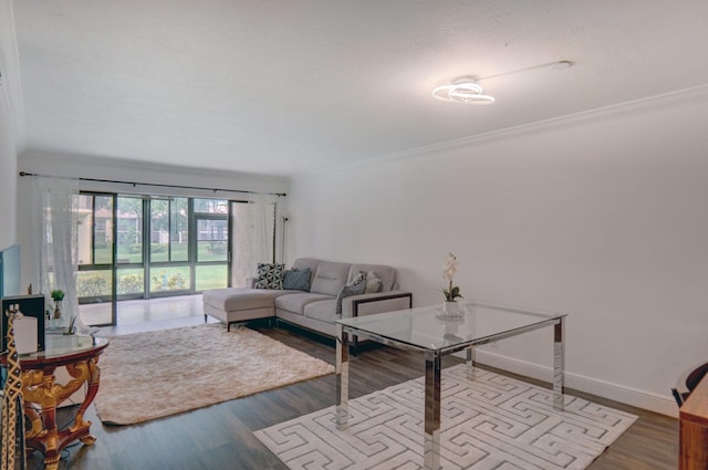 living room featuring crown molding and wood-type flooring