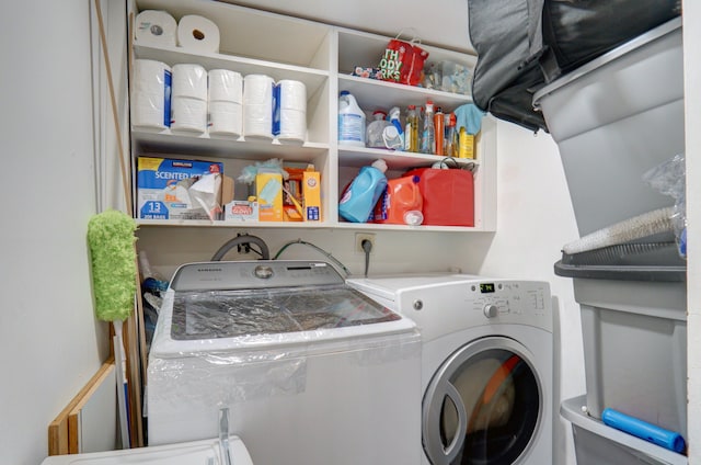 washroom featuring washer and dryer