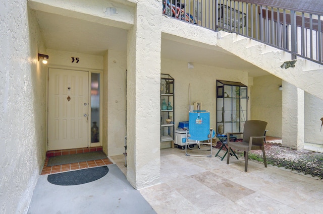 doorway to property featuring a patio area