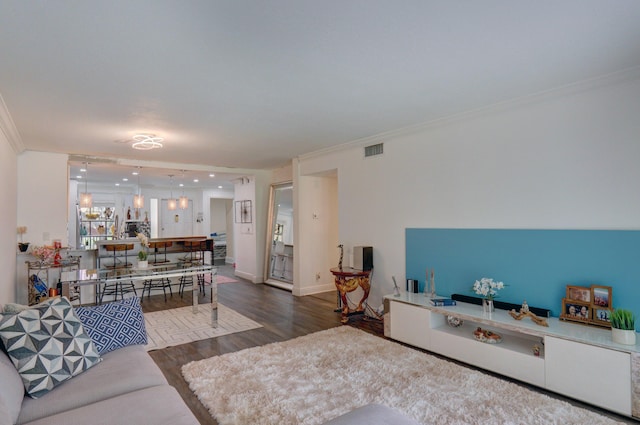 living room featuring crown molding and wood-type flooring