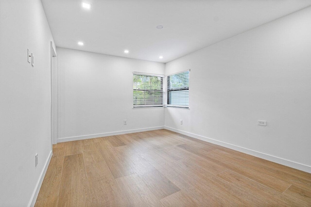 spare room featuring light wood-type flooring