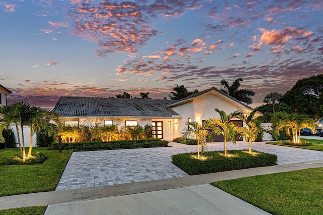 view of front of property with a yard