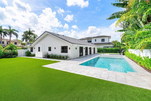 view of swimming pool with a yard, a patio area, and a pergola