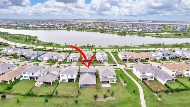 birds eye view of property featuring a water view