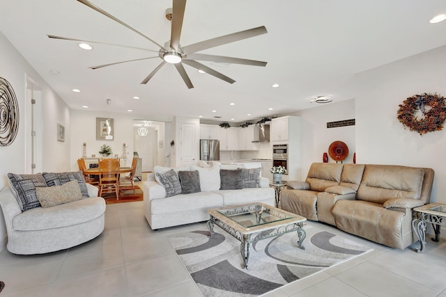 living room featuring ceiling fan and light tile patterned floors