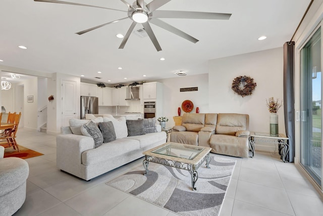 tiled living room featuring ceiling fan