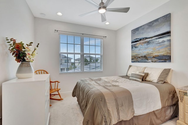 bedroom featuring ceiling fan and light carpet