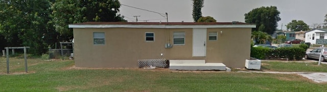 view of outbuilding with a lawn