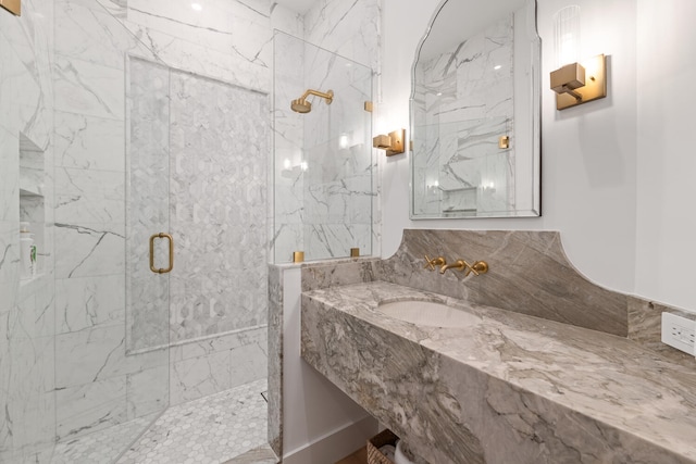 bathroom featuring vanity and a shower with door