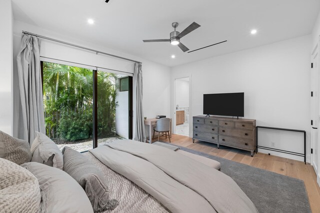 bedroom with light hardwood / wood-style flooring, ensuite bath, ceiling fan, and access to exterior