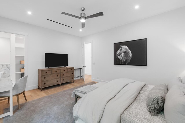 bedroom featuring light hardwood / wood-style floors and ceiling fan