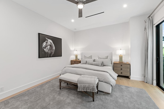 bedroom featuring ceiling fan and light hardwood / wood-style flooring