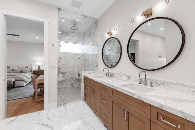 bathroom featuring hardwood / wood-style floors, an enclosed shower, and double vanity