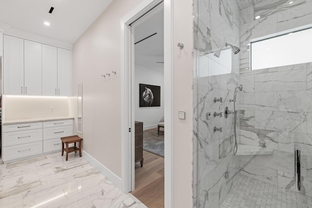 bathroom with hardwood / wood-style floors and walk in shower