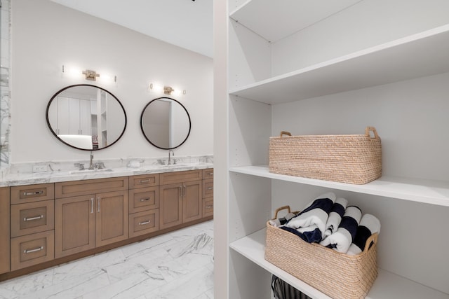 bathroom with tile patterned flooring and dual bowl vanity