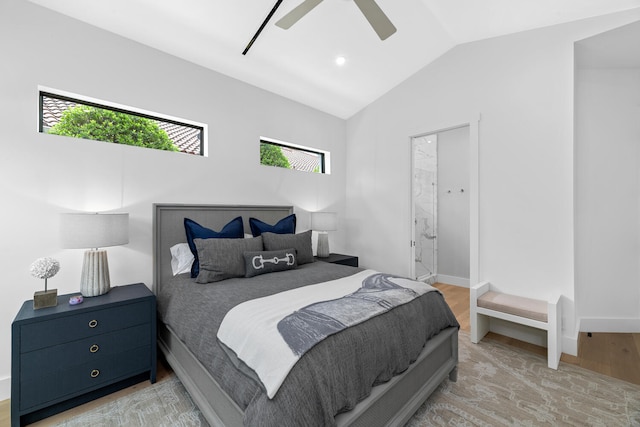 bedroom with lofted ceiling, light hardwood / wood-style flooring, multiple windows, and ceiling fan