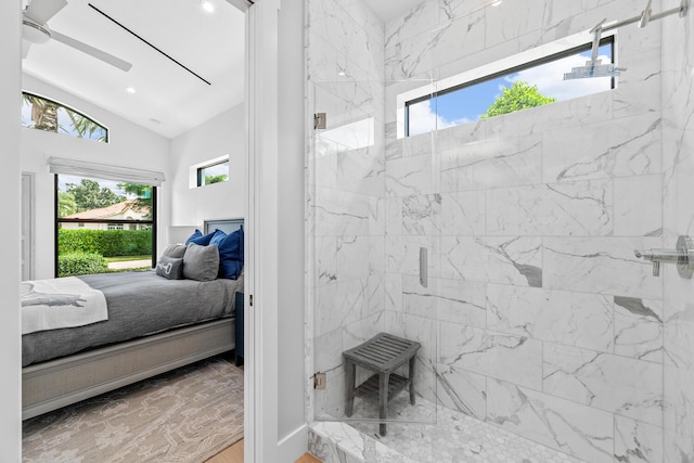 bathroom with lofted ceiling, a shower with shower door, and ceiling fan