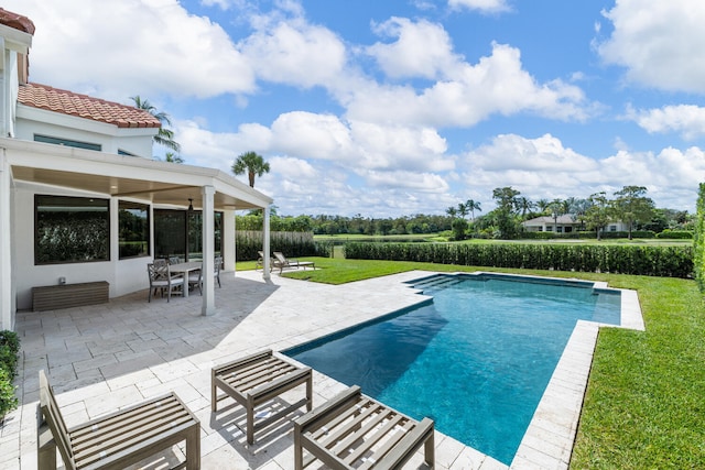 view of pool featuring a patio and a lawn