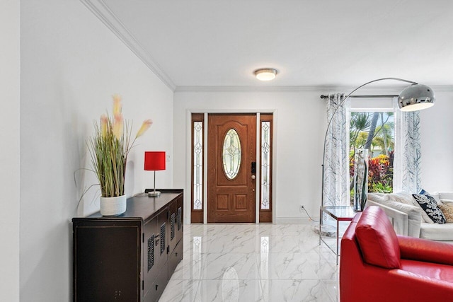 foyer entrance with marble finish floor, crown molding, and baseboards