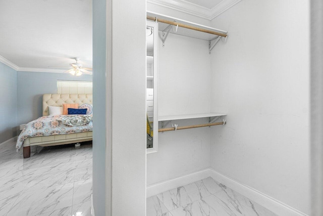 walk in closet with ceiling fan and marble finish floor