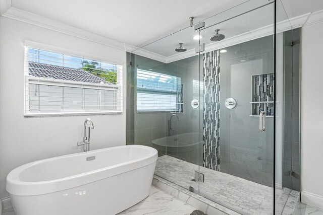 bathroom featuring marble finish floor, a soaking tub, ornamental molding, and a shower stall