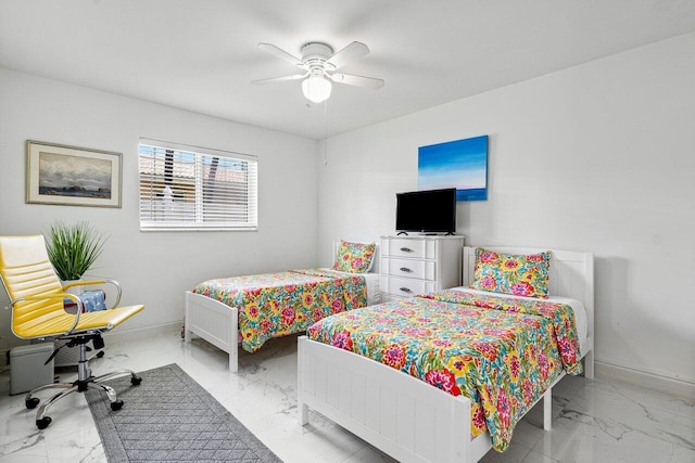 bedroom featuring marble finish floor, baseboards, and a ceiling fan